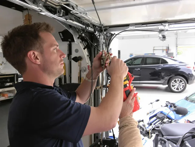 Trumbull Center Garage Door Repair safety certified technician performing cable replacement in Trumbull Center