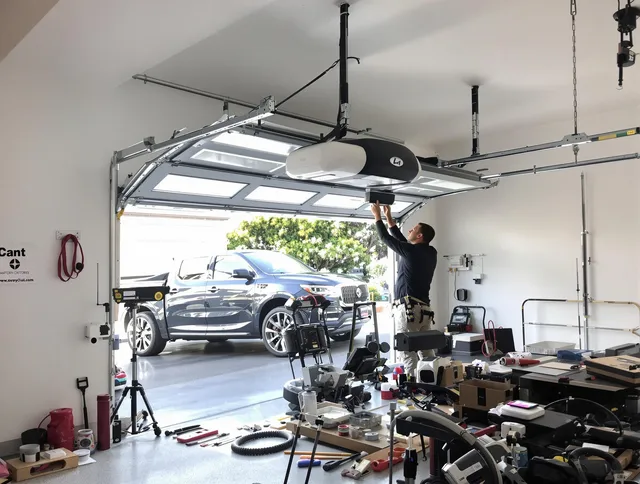 Trumbull Center Garage Door Repair specialist installing smart garage door opener system in Trumbull Center home