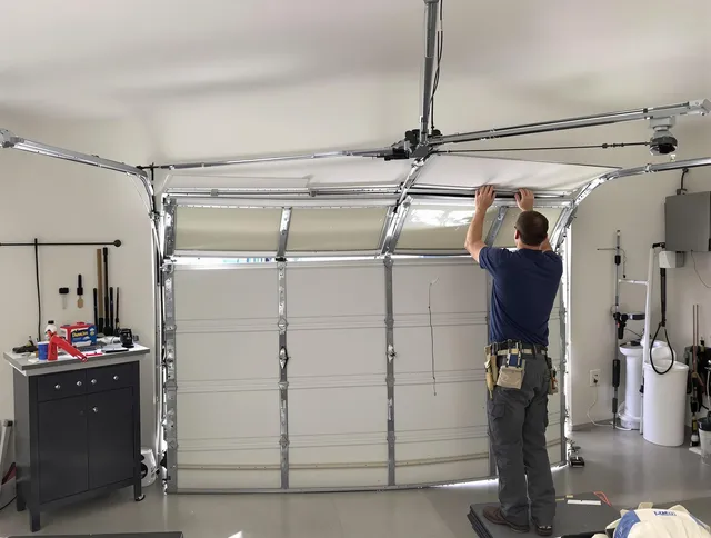 Trumbull Center Garage Door Repair specialist performing precise section replacement on Trumbull Center garage door